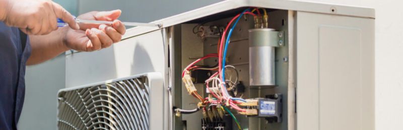 Furnace technician repairing a heating system in La Mesa CA